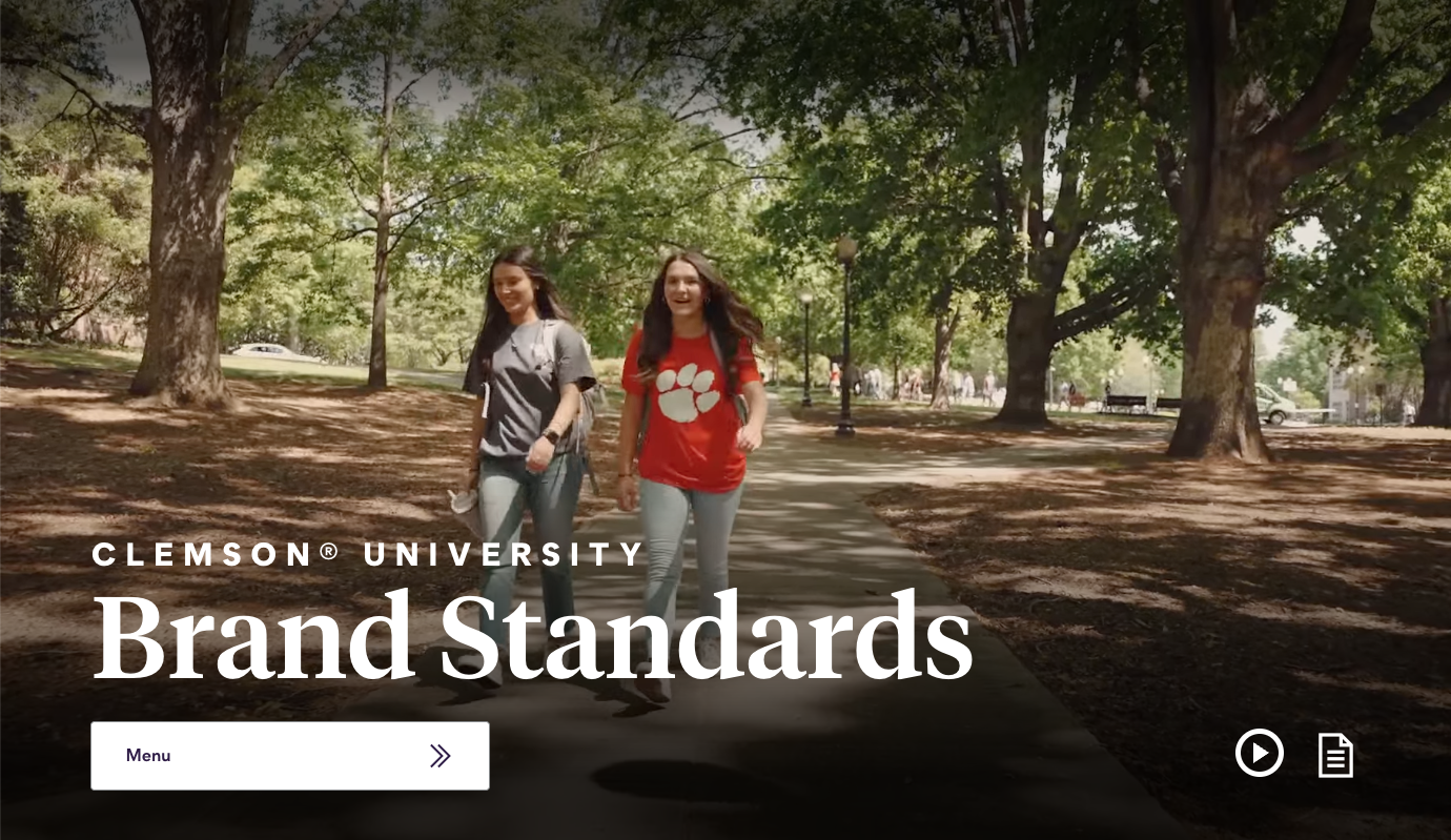 Clemson University brand standards site showing large hero video with menu button and accessibility controls